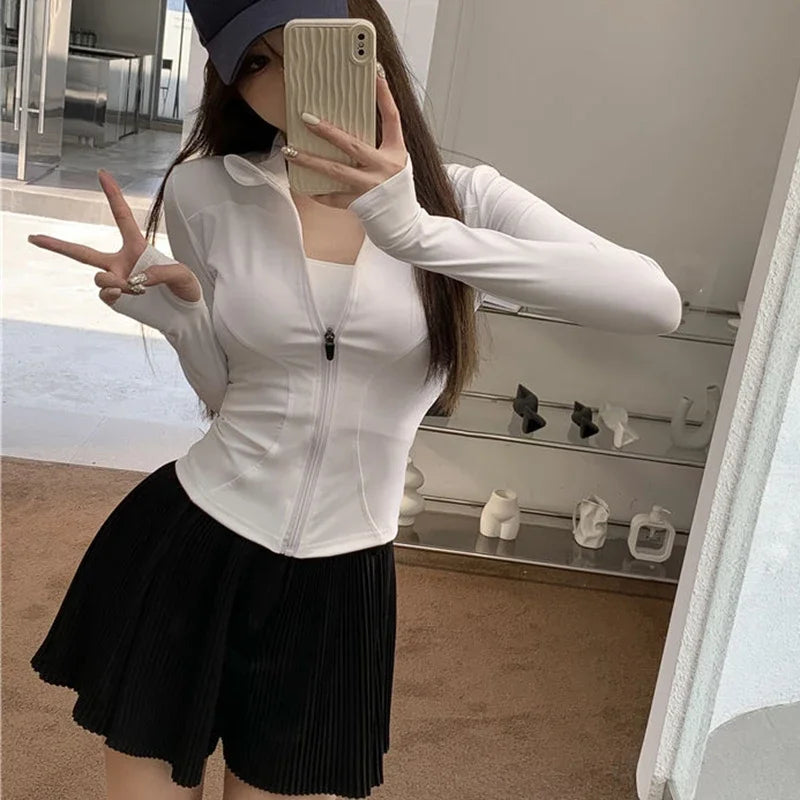 Camiseta Feminina 2026 Slim Fit – Blusa de Manga Longa com Zíper, Modelagem Ajustada, Proteção UV e Estilo Fitness para Yoga